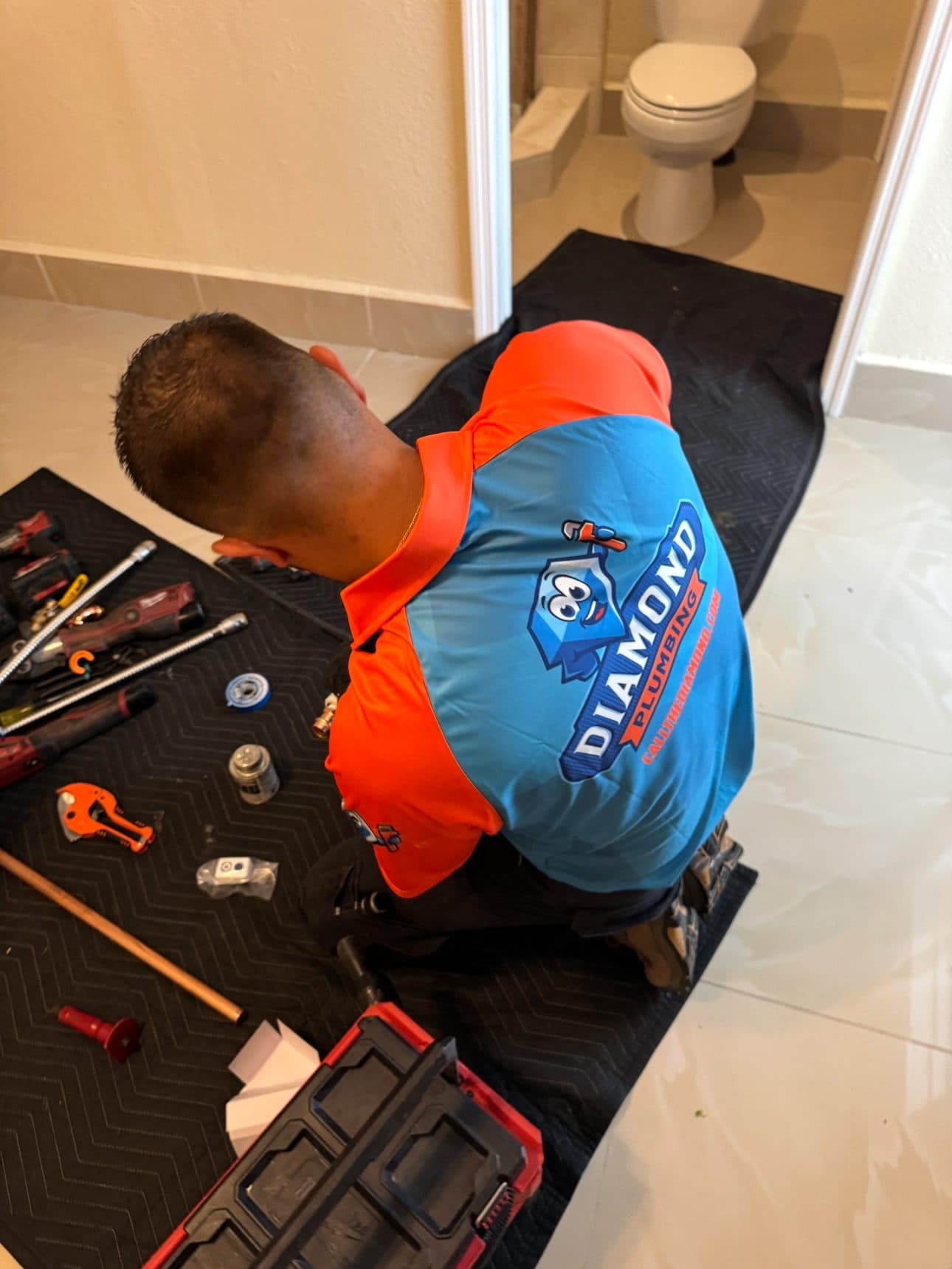 Diamond Plumbing technician on a bathroom plumbing service call